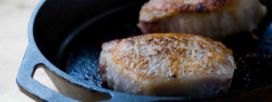 Thick pork chops with salt and pepper